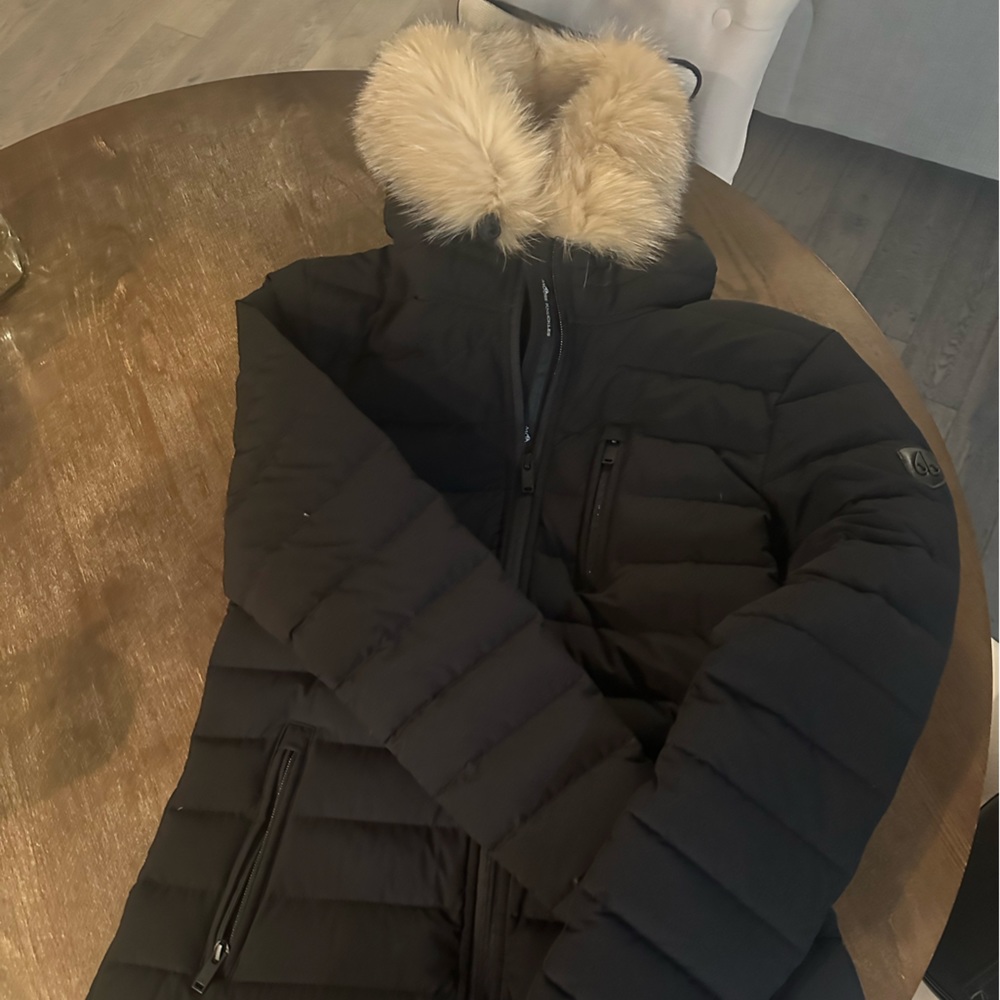 Moose knuckles black jacket.  Hardly worn, and has real fur around hood